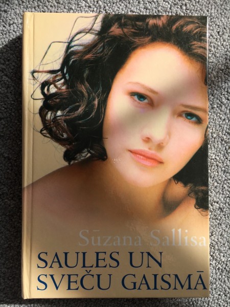 Saules un sveču gaismā