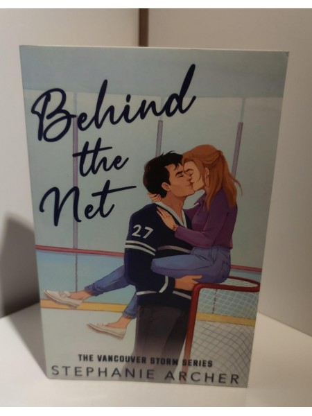 Behind the net
